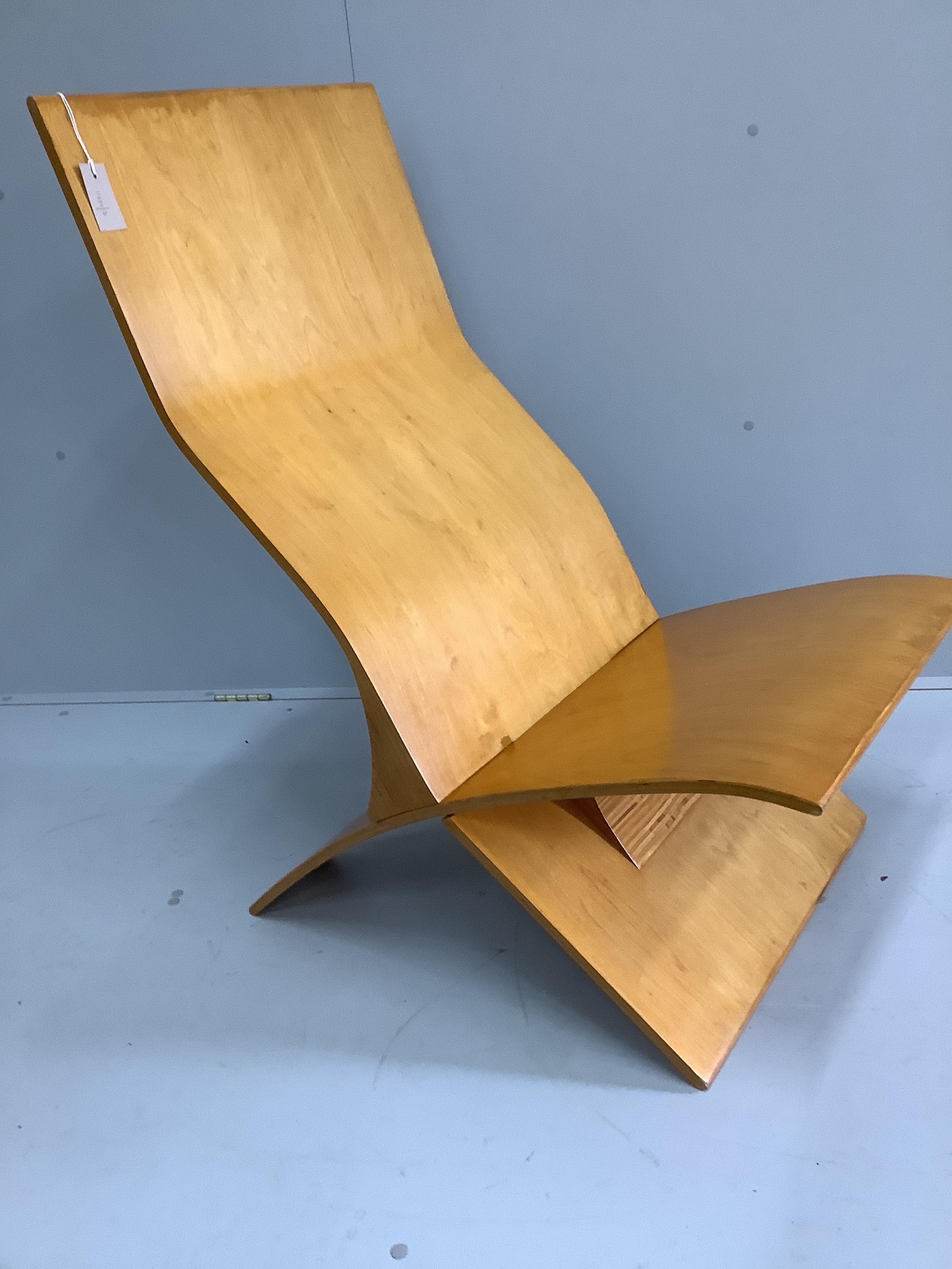 In the manner of Jens Nielson a mid century bent ply two section chair, width 56cm, depth 80cm, height 101cm